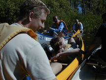 People paddling canoes. Photo.