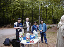 People in the forest getting coffee. Photo. 