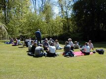 People relaxing in the grass. Photo.