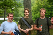 Three guys in the forest. Photo. 