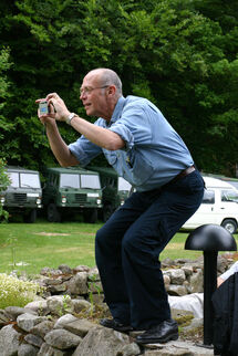 A man taking a photo. Photo. 