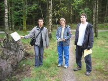 Three people in the nature. Photo. 